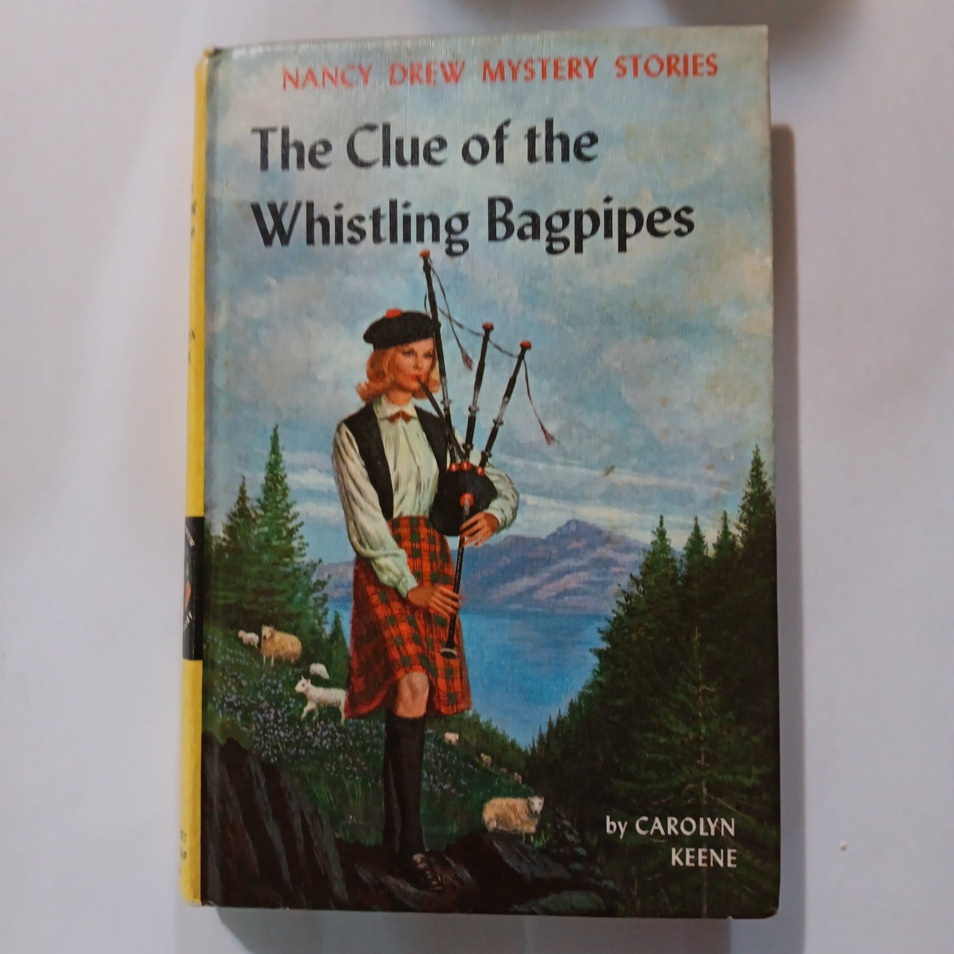 The Clue of the Whistling Bagpipes - [ash-ling] Booksellers