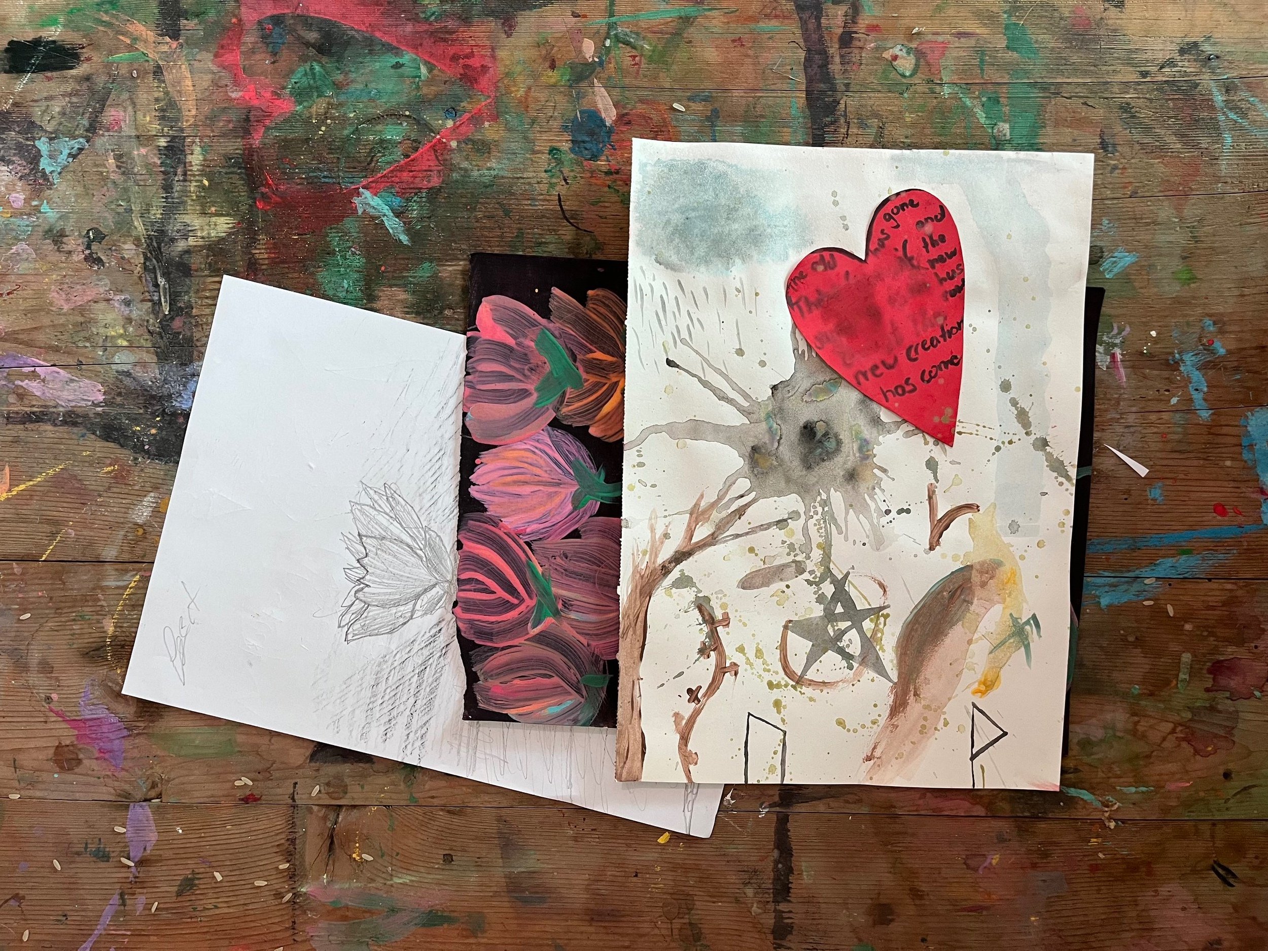 A handmade card with a painted tree and abstract splashes.